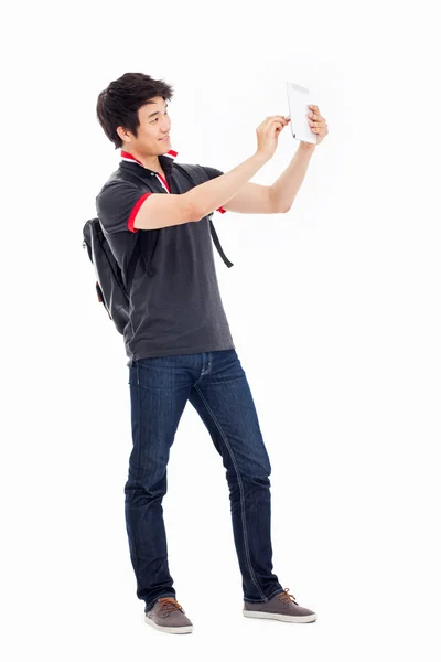 Young Asian student using pad PC — Stock Photo, Image