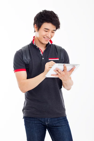 Junge asiatische Student mit Pad PC — Stockfoto