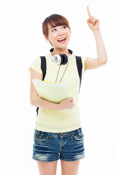 Young Asian stdudent girl pointing up space. — Stock Photo, Image