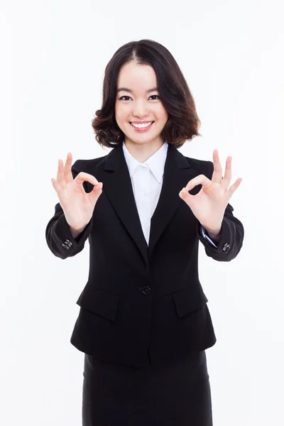 Young Asian business woman showing okay sign — Stock Photo, Image