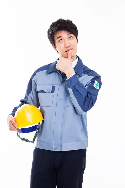 Thinking young Asian engineer — Stock Photo, Image