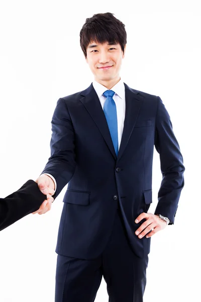 Joven hombre de negocios extendiendo la mano para estrechar — Foto de Stock