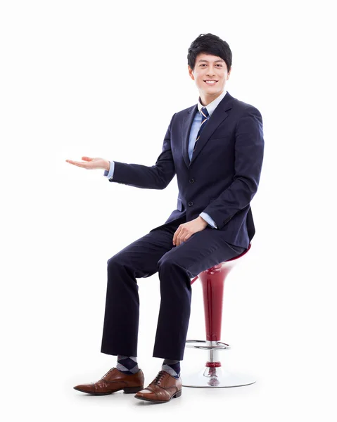 Young Asian business man showing something — Stock Photo, Image