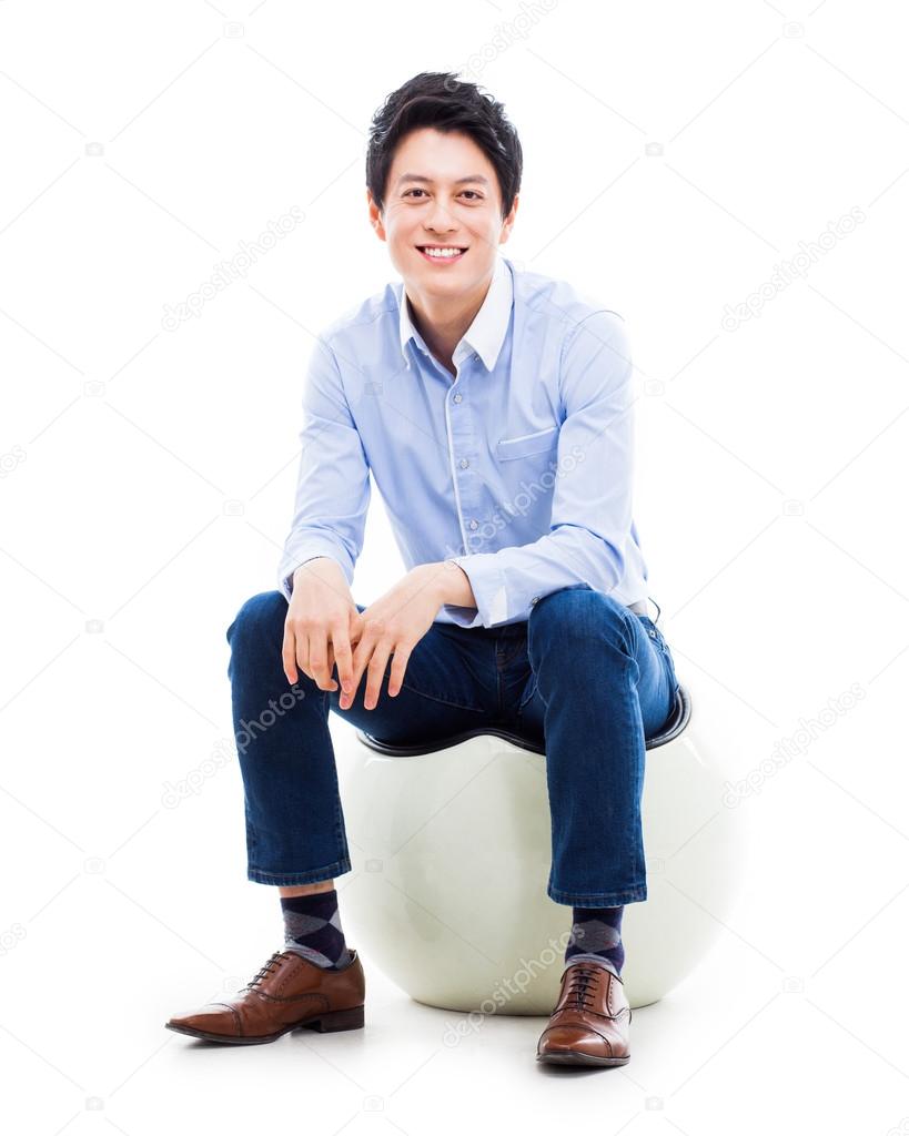 Young Asian person sitting on the chair.