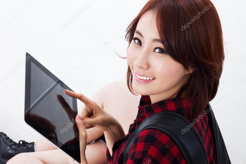 Young Asian student woman using a pad PC