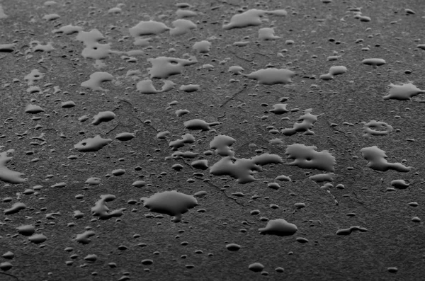 Macro shot of a slate plate with water drops — Stock Photo, Image