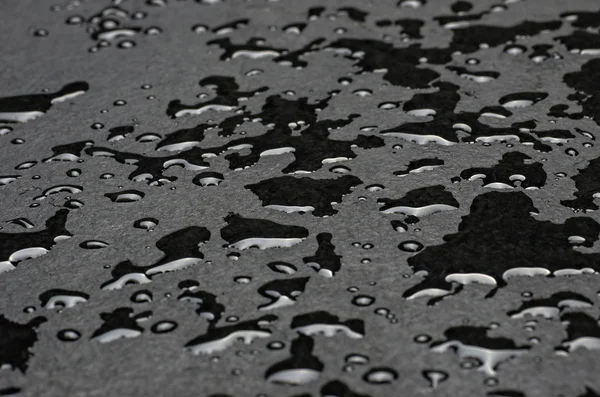 Macro shot of a slate plate with water drops — Stock Photo, Image