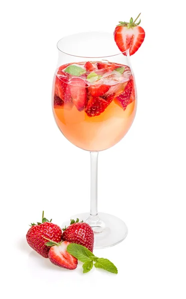 Drink with strawberries and mint in a wine glass — Stock Photo, Image