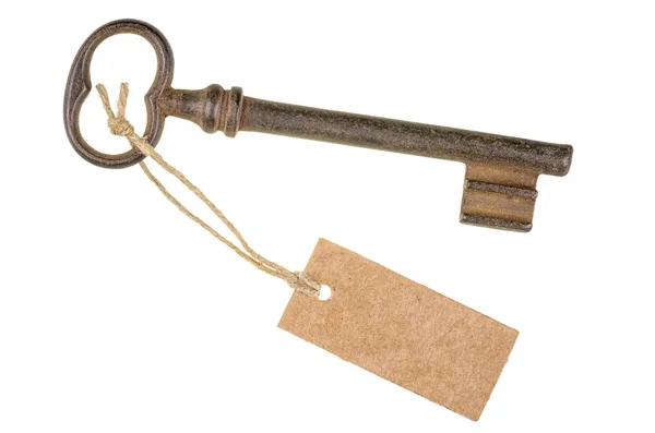 Oude sleutel met een tag — Stockfoto