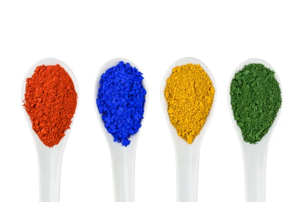 Vibrant color pigments in porcelain spoons — Stock Photo, Image