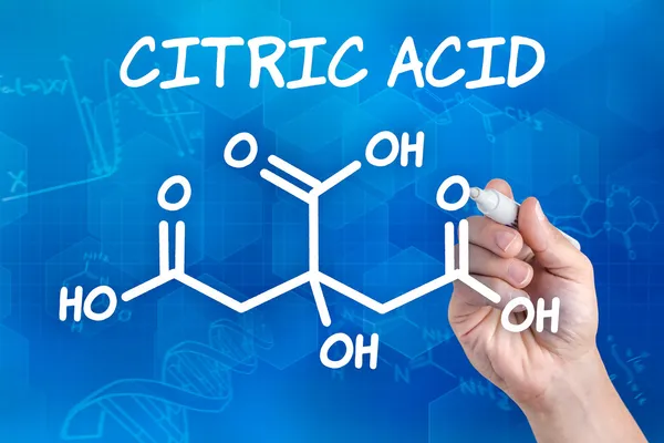 Hand with pen drawing the chemical formula of citric acid — Stock Photo, Image