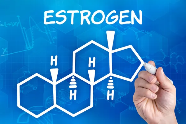 Hand with pen drawing the chemical formula of Estrogen — Stock Photo, Image