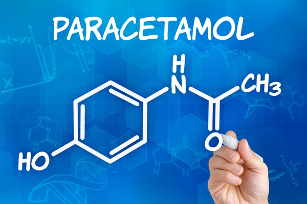 Hand met pen tekening de chemische formule van paracetamol — Stockfoto