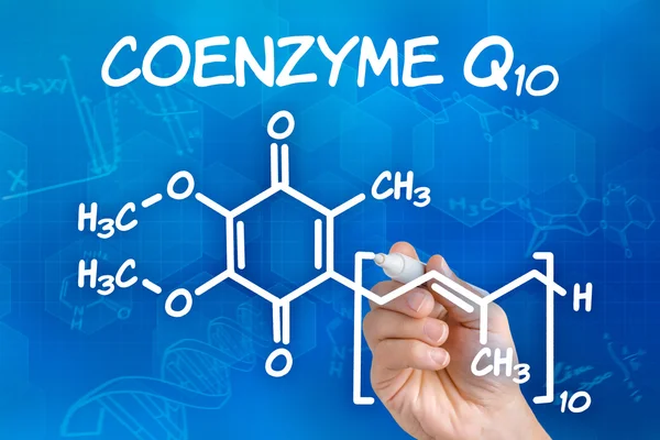 Hand with pen drawing the chemical formula of coenzyme Q10 — Stock Photo, Image