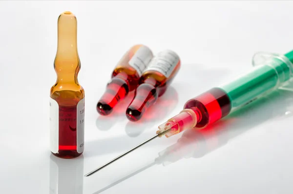 Syringe with glass vials — Stock Photo, Image