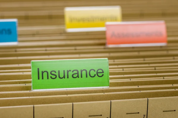 Hanging file folder labeled with Insurance — Stock Photo, Image