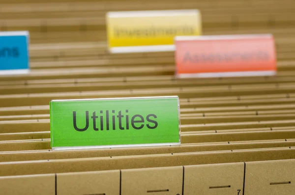 Opknoping bestandsmap met de naam met utilities — Stockfoto