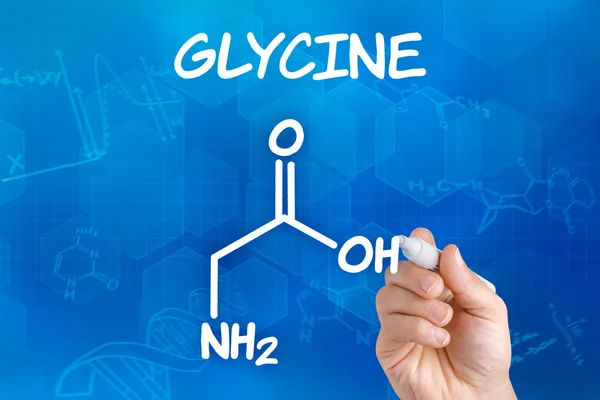 Hand met pen tekening de chemische formule van glycine — Stockfoto