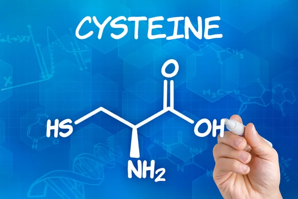 Mão com caneta desenhando a fórmula química da cisteína — Fotografia de Stock