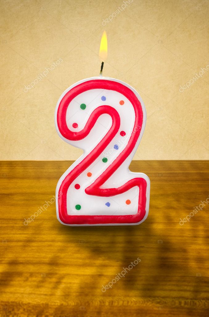 Burning birthday candle — Stock Photo © Zerbor 42529753