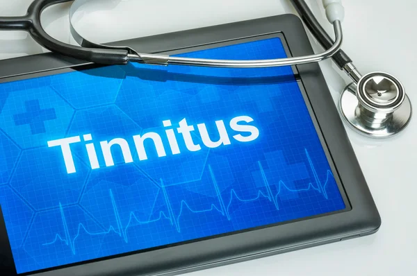 Tableta con el diagnóstico de tinnitus en la pantalla —  Fotos de Stock