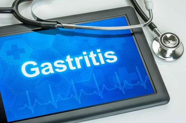 Comprimido com o diagnóstico gastrite na tela — Fotografia de Stock