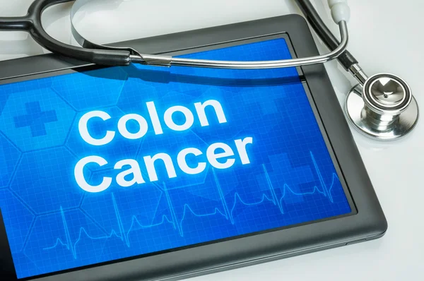 Tableta con el diagnóstico de cáncer de colon en la pantalla —  Fotos de Stock