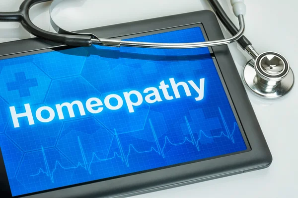 Tablet with the text Homeopathy on the display — Stock Photo, Image