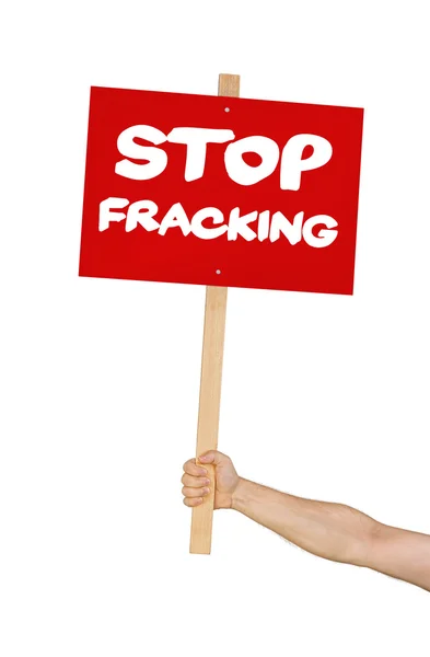 Persona sosteniendo un letrero que dice Deja de Fracking —  Fotos de Stock