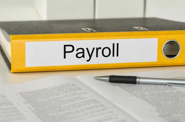 Folder with the label Payroll — Stock Photo, Image