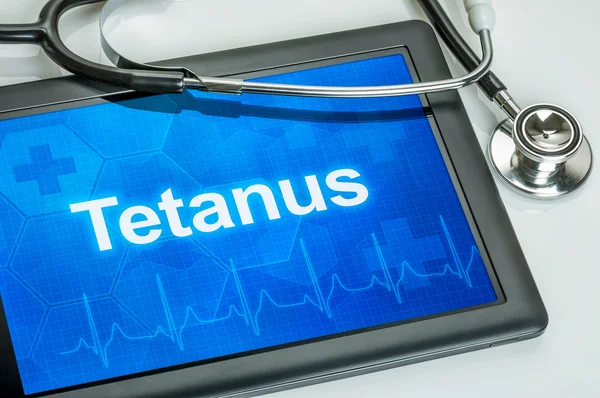 Tablet met de diagnose tetanus op het display — Stockfoto