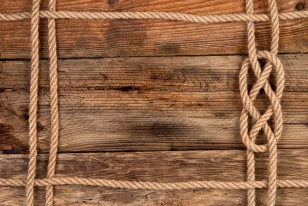 Rope frame on wooden background — Stock Photo, Image