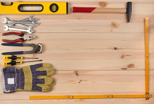 Wooden desk with tools and copy space — Stock Photo, Image