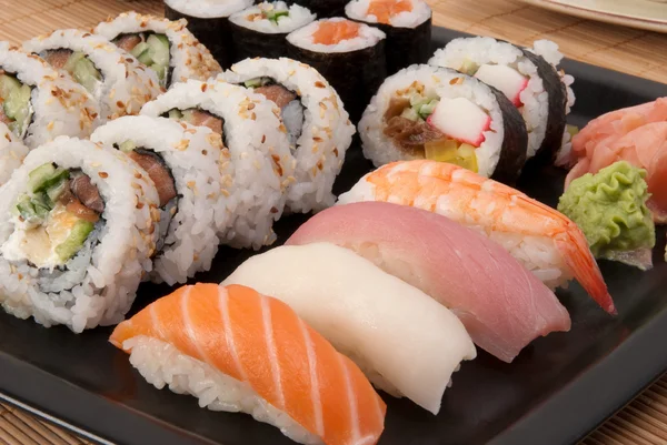 Sushi maki and nigiri served with ginger and wasabi — Stock Photo, Image