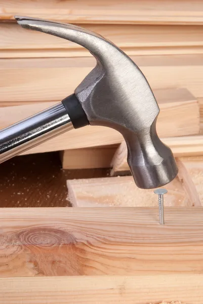 Hammer hitting a nail — Stock Photo, Image