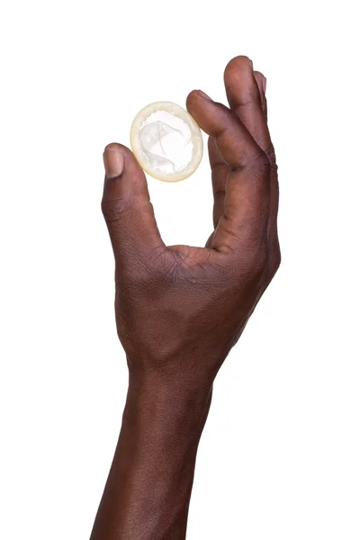 Hand with condom isolated on white — Stock Photo, Image
