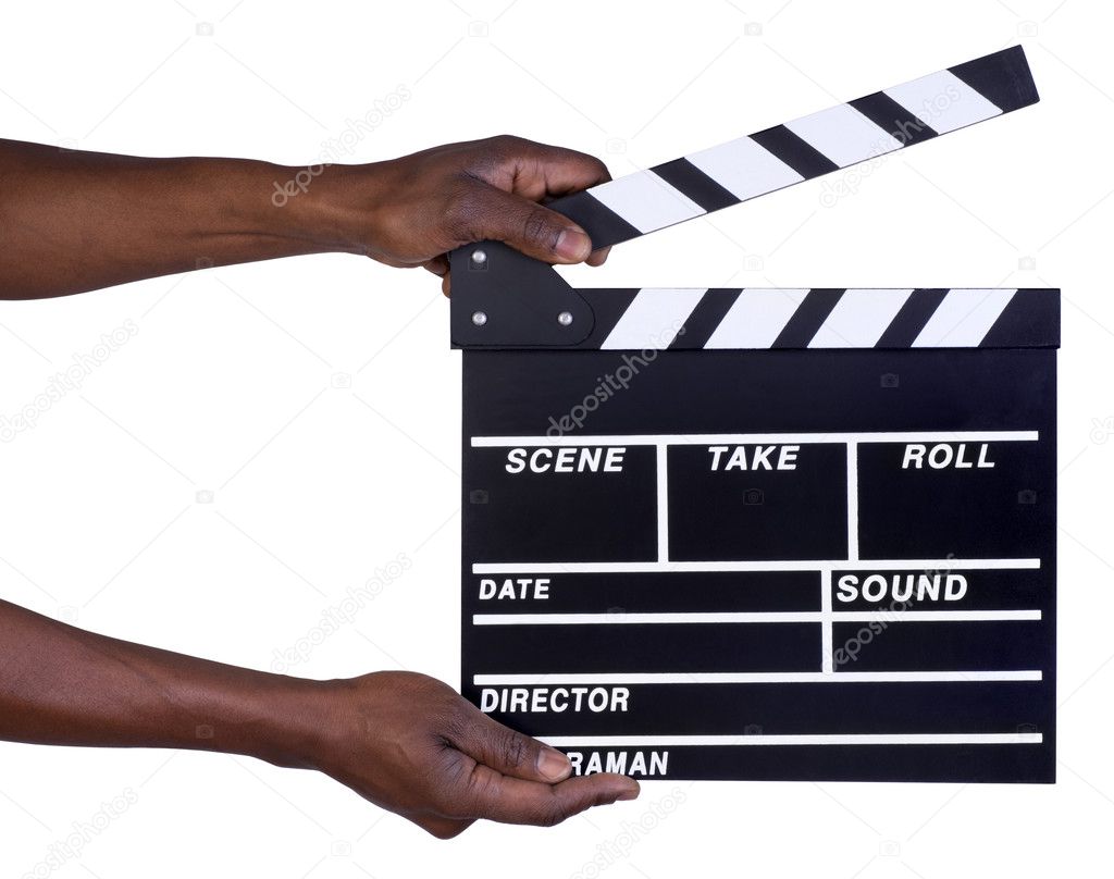 Man holding movie production clapper board