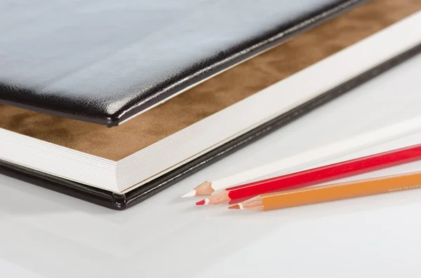 Photo album and color pencils — Stock Photo, Image