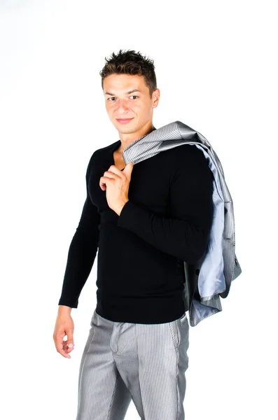 Young man holding coat over shoulders isolated on white backgrou — Stock Photo, Image