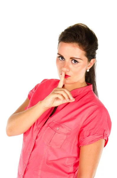 Junge Frau mit einem Finger auf den Lippen — Stockfoto