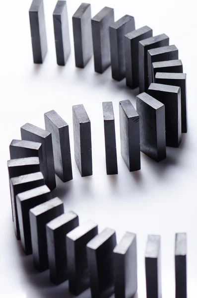 Black dominoes in a row — Stock Photo, Image