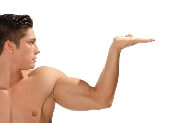 Muscular man showing your product — Stock Photo, Image