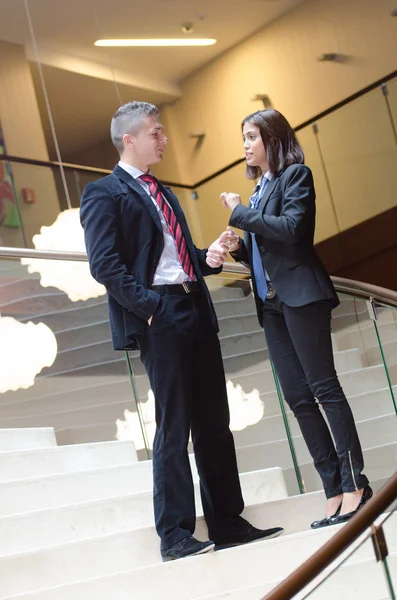 Businessman and business woman talking — Stock Photo, Image