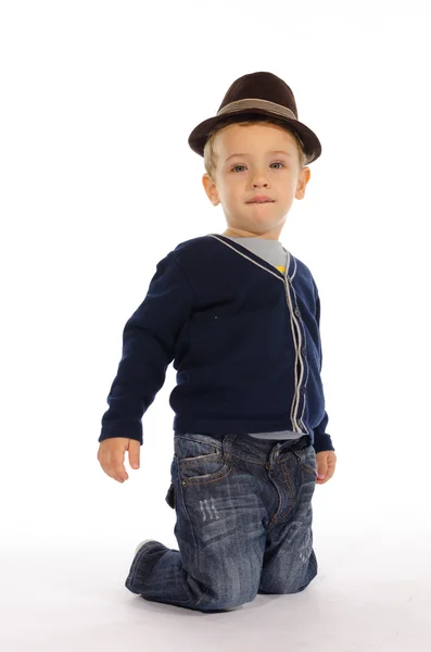 Portrait of child sitting on his knees — Stock Photo, Image