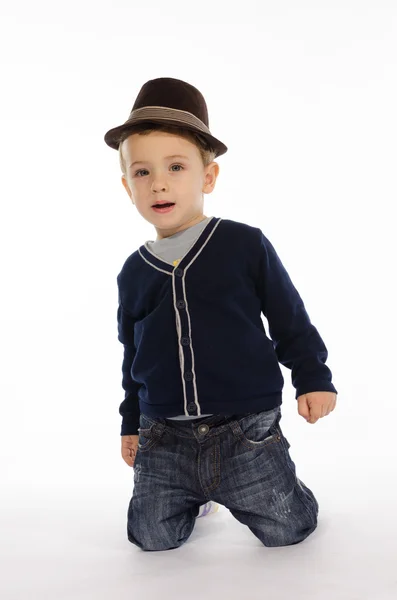 Portrait of child sitting on his knees — Stock Photo, Image