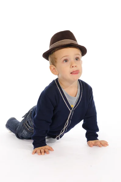 Portrait of child sitting on his knees and hands — Stock Photo, Image