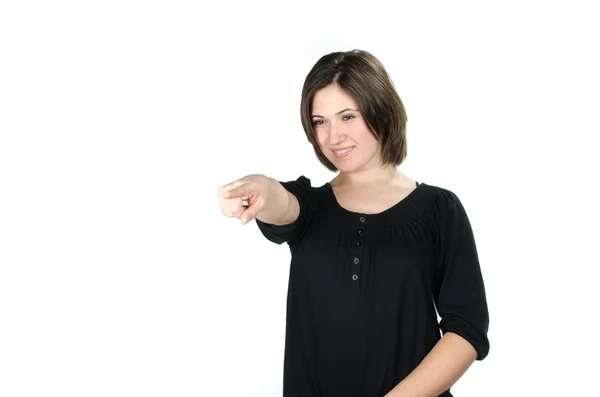 Portrait of young woman pointing in front of her — Stock Photo, Image