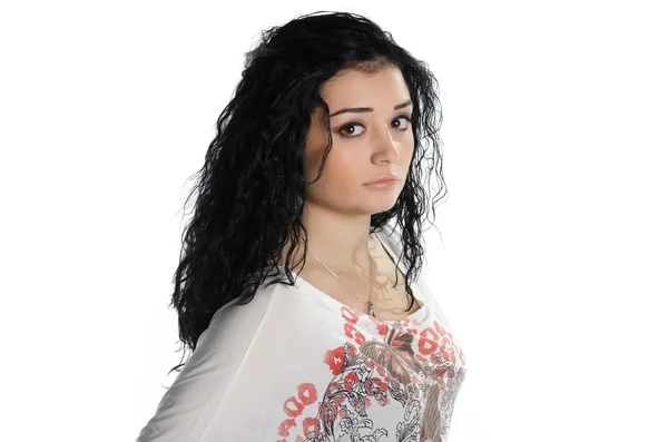 Portrait of young woman with black hair posing — Stock Photo, Image