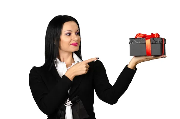 Beautiful brunette showing a present box — Stock Photo, Image