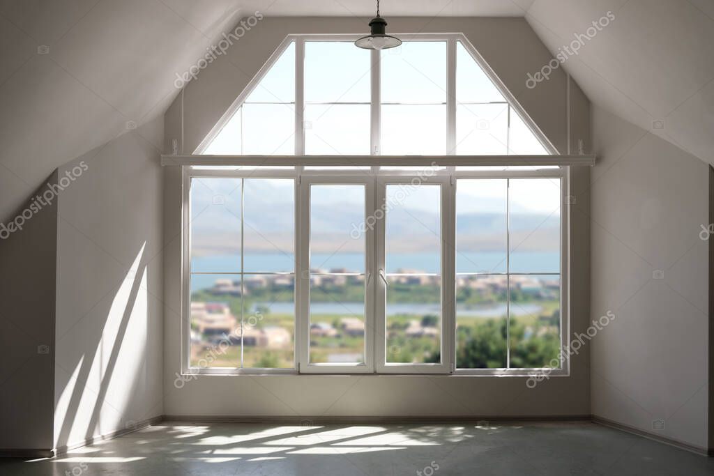Sunlight peeking through the large window in the interior with nature background outside